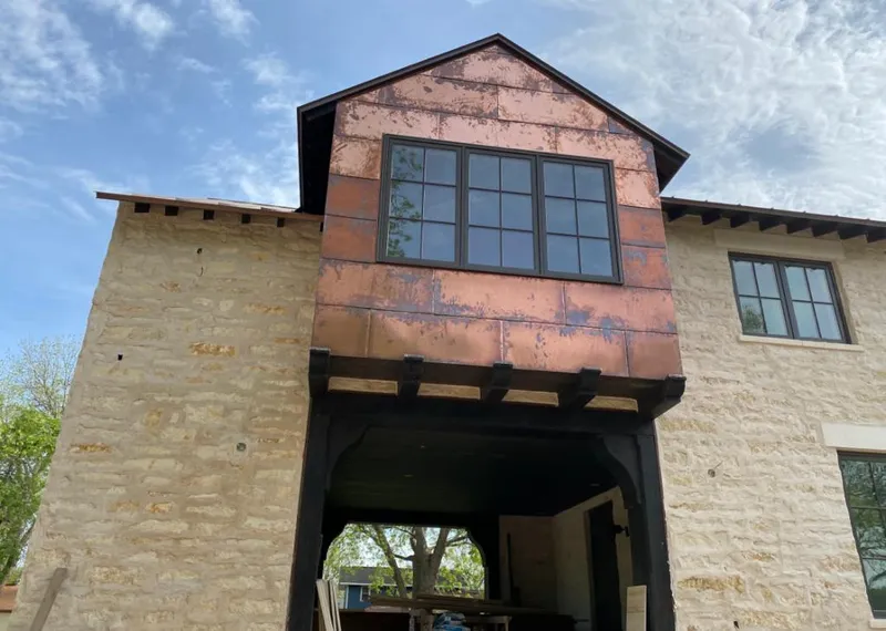 Copper metal panel facade on a stone building for Metal Roof Coating in Linda